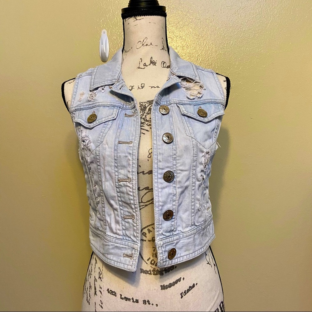 Distressed light wash denim vest